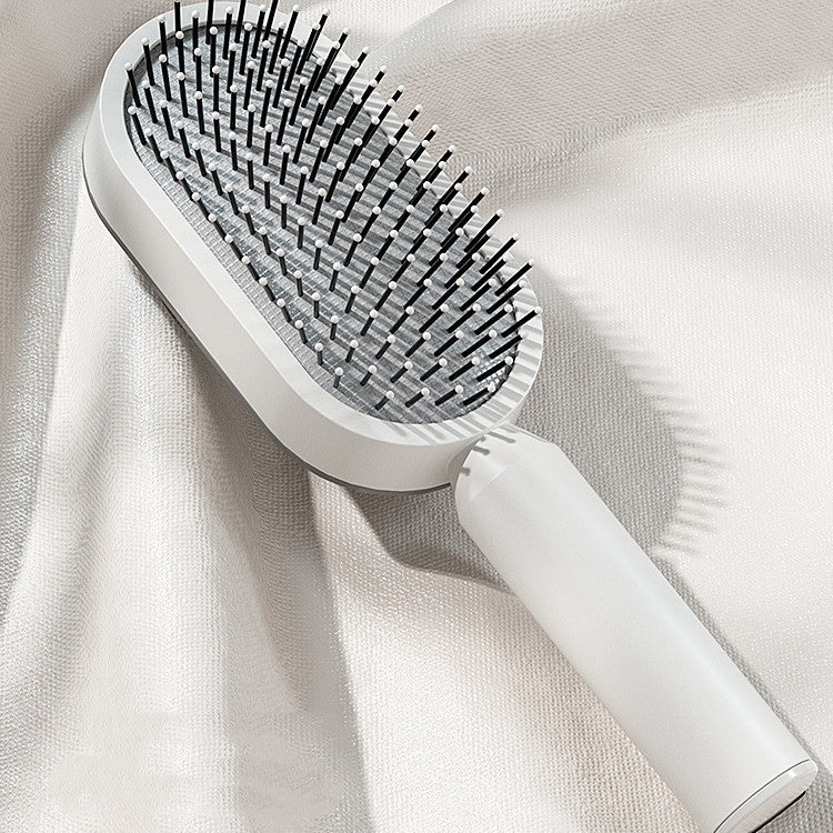 Elegant white Self Cleaning Hair Brush with one-click function
